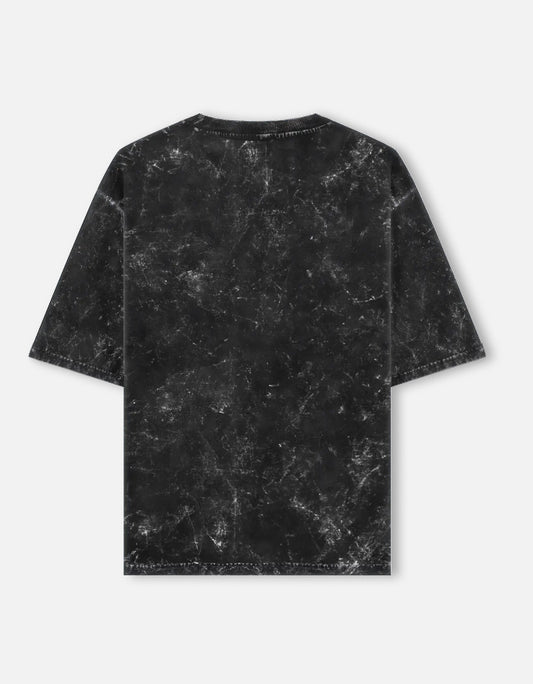 Color_Black. Oversized unisex t-shirt with a vintage acid-washed or mineral-wash texture. Features a faded, marbled grey and black aesthetic with a drop-shoulder, boxy fit. High-quality cotton streetwear with a distressed, retro finish.
