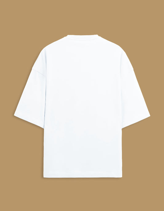 Color_White. Oversized white streetwear t-shirt featuring a centered rectangular graphic of a classical South Asian miniature painting with an orange border. Dropped shoulders, heavyweight cotton, boxy fit.