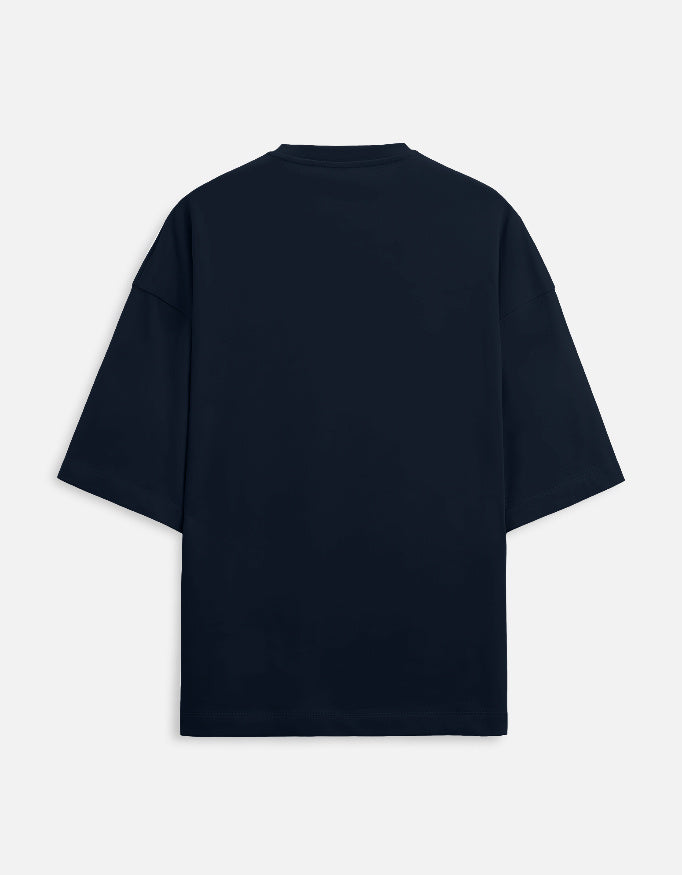 Color_NavyBlue. oversized t-shirt featuring a colorful graphic inspired by a video game selection screen. It displays portraits of horror icons like Jason Voorhees and Freddy Krueger under the stylized orange and yellow title "Fatal Curry."