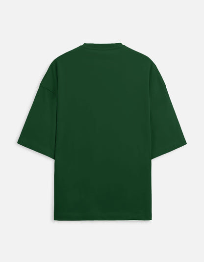 Bottle Green oversized unisex t-shirt featuring a small, centered graphic of the Hindi text "भंडलोक" (Bhandlok - Wild/Drunk People) in light red, topped with a small red dot. Soft cotton, drop-shoulder, boxy casual apparel with a party-themed or humorous typographic design.