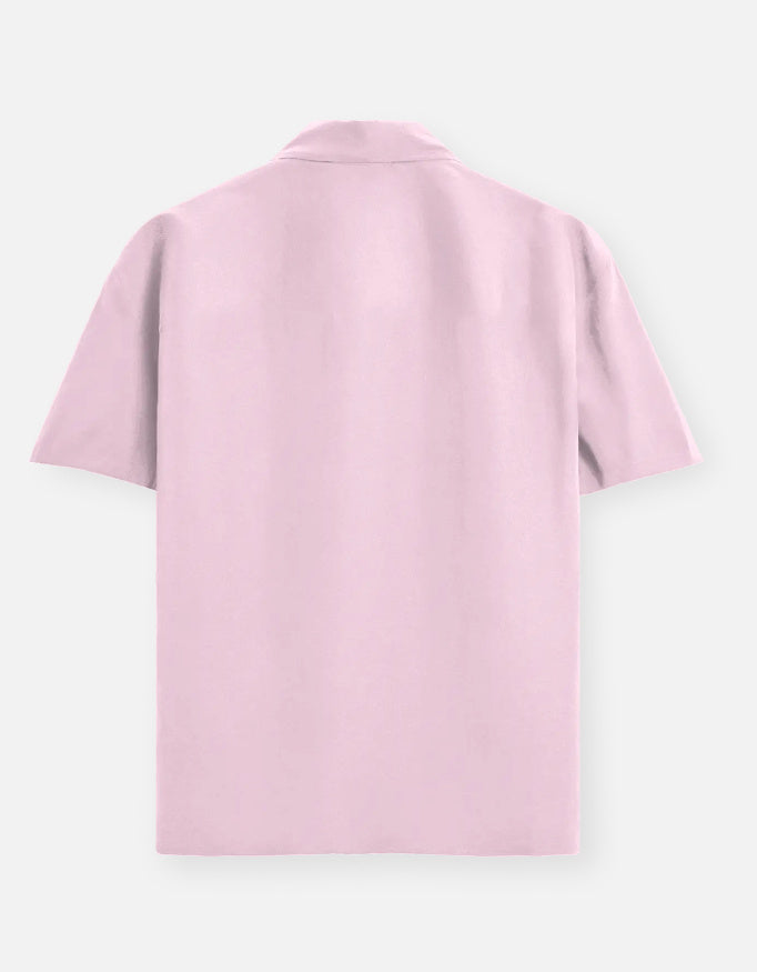 Color_LightBabyPink. Classic long-sleeved button-down shirt in a solid premium cotton fabric. Features a structured collar, adjustable cuffs, and a regular fit designed for a versatile unisex silhouette. Ideal for smart-casual styling and layering.