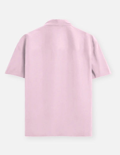 Color_LightBabyPink. Classic long-sleeved button-down shirt in a solid premium cotton fabric. Features a structured collar, adjustable cuffs, and a regular fit designed for a versatile unisex silhouette. Ideal for smart-casual styling and layering.