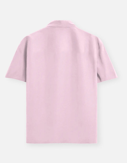 Color_LightBabyPink. Classic long-sleeved button-down shirt in a solid premium cotton fabric. Features a structured collar, adjustable cuffs, and a regular fit designed for a versatile unisex silhouette. Ideal for smart-casual styling and layering.