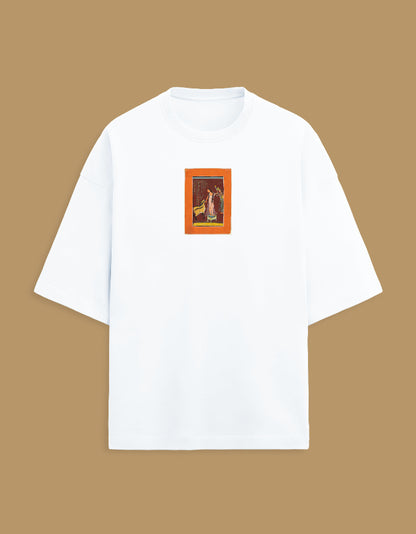 Color_White. Oversized white streetwear t-shirt featuring a centered rectangular graphic of a classical South Asian miniature painting with an orange border. Dropped shoulders, heavyweight cotton, boxy fit.
