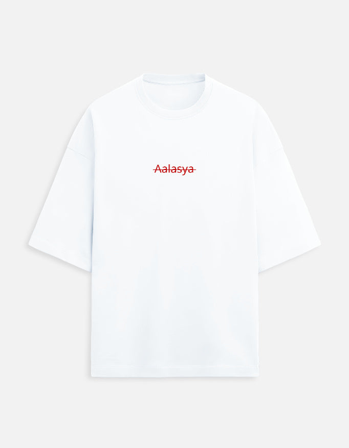 Color_White. versized unisex t-shirt featuring a centered, small graphic of the word "Aalasya" (laziness) written in red, stylized text with a red strikethrough line, signifying "No Laziness." Soft cotton, drop-shoulder, boxy casual apparel with ironic or statement typography.