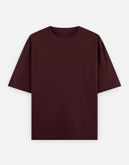 Color_Maroon. High-quality oversized unisex t-shirt with a classic crew neck and drop-shoulder construction. Smooth, heavy-weight cotton fabric in a solid color, offering a relaxed, boxy streetwear fit for a timeless aesthetic.