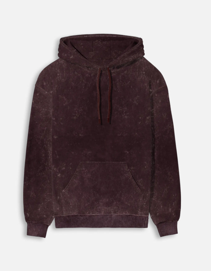 Color_Maroon. mineral-wash unisex heavyweight hoodie. 300 GSM cotton brushed fleece with a distressed, textured finish. Features a kangaroo pocket, matching drawstrings, and ribbed finishes. Architectural streetwear fit for cold weather.