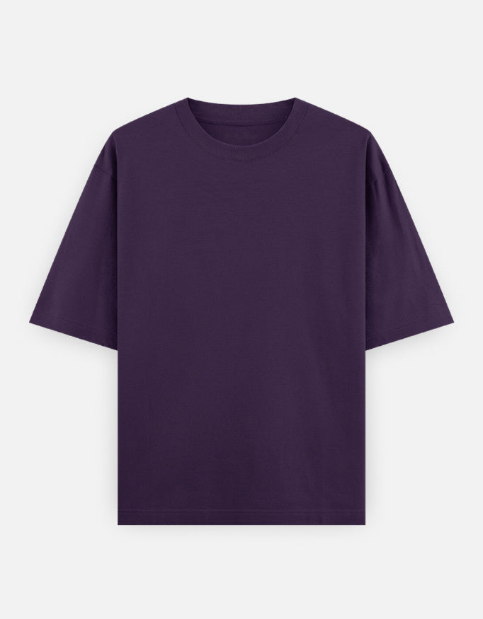 Color_Purple. Oversized plain classic streetwear t-shirt in a premium heavyweight cotton blend. Features a boxy silhouette, dropped shoulders, and a clean, minimalist aesthetic without graphics.