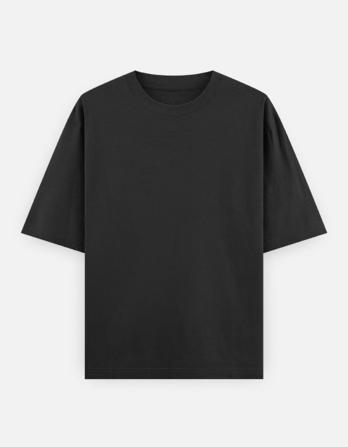 Color_Black.Oversized plain classic streetwear t-shirt in a premium heavyweight cotton blend. Features a boxy silhouette, dropped shoulders, and a clean, minimalist aesthetic without graphics.
