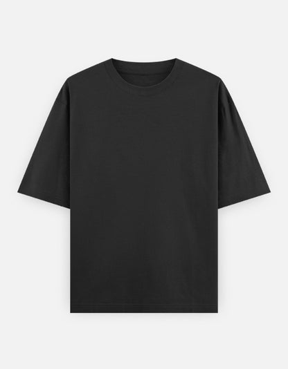 Color_Black.Oversized plain classic streetwear t-shirt in a premium heavyweight cotton blend. Features a boxy silhouette, dropped shoulders, and a clean, minimalist aesthetic without graphics.