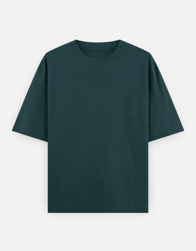 Color_PetrolBlue. High-quality oversized unisex t-shirt with a classic crew neck and drop-shoulder construction. Smooth, heavy-weight cotton fabric in a solid color, offering a relaxed, boxy streetwear fit for a timeless aesthetic.