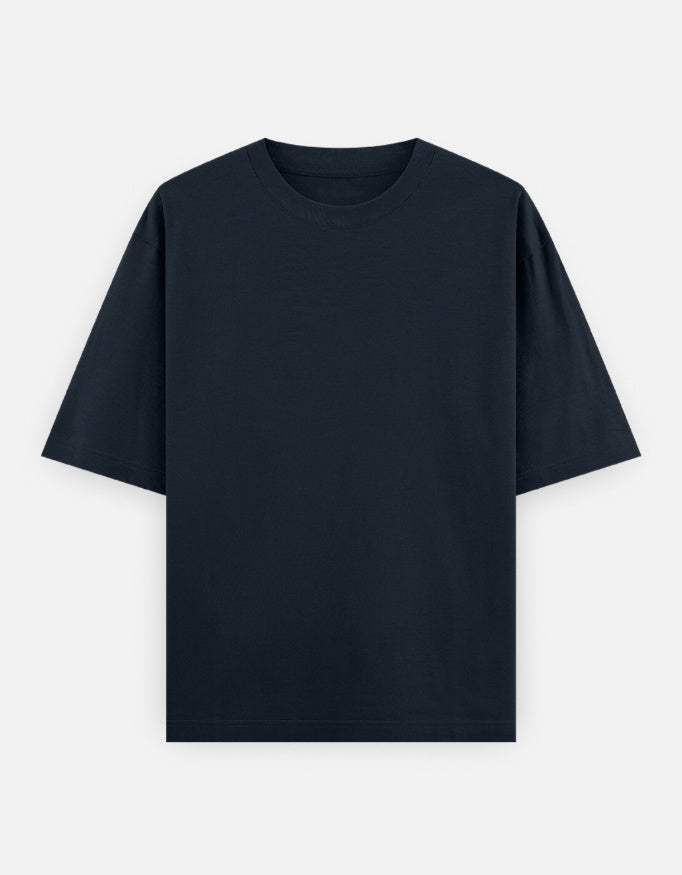 Color_NavyBlue. High-quality oversized unisex t-shirt with a classic crew neck and drop-shoulder construction. Smooth, heavy-weight cotton fabric in a solid color, offering a relaxed, boxy streetwear fit for a timeless aesthetic.