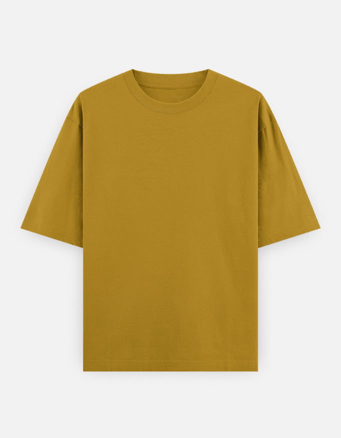 Color_MustardYellow. Oversized plain classic streetwear t-shirt in a premium heavyweight cotton blend. Features a boxy silhouette, dropped shoulders, and a clean, minimalist aesthetic without graphics.