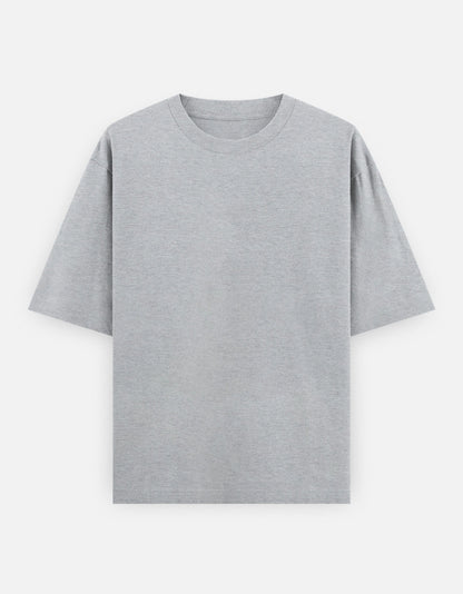 Color_GreyMelange. High-quality oversized unisex t-shirt with a classic crew neck and drop-shoulder construction. Smooth, heavy-weight cotton fabric in a solid color, offering a relaxed, boxy streetwear fit for a timeless aesthetic.