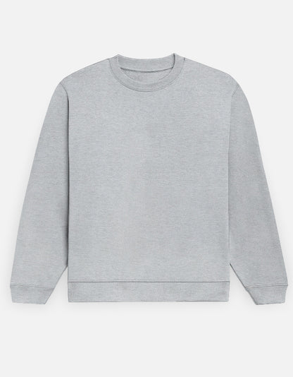 Color_GreyMelange. Premium solid-colored unisex crewneck sweatshirt made from 100% cotton and 300 GSM brushed fleece. Features a relaxed regular fit with snug ribbed cuffs and a structured hem. High-quality, heavyweight cozy apparel designed for cold weather and casual streetwear.