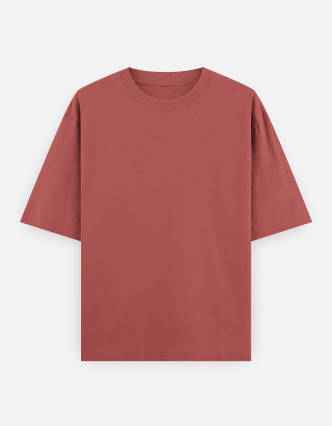 Color_Coral. High-quality oversized unisex t-shirt with a classic crew neck and drop-shoulder construction. Smooth, heavy-weight cotton fabric in a solid color, offering a relaxed, boxy streetwear fit for a timeless aesthetic.