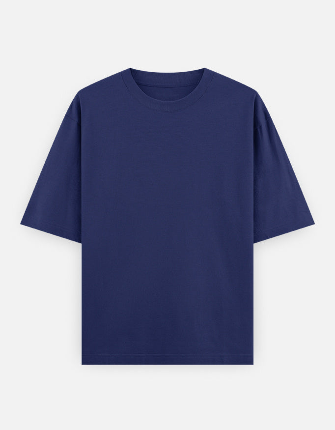Color_RoyalBlue. High-quality oversized unisex t-shirt with a classic crew neck and drop-shoulder construction. Smooth, heavy-weight cotton fabric in a solid color, offering a relaxed, boxy streetwear fit for a timeless aesthetic.