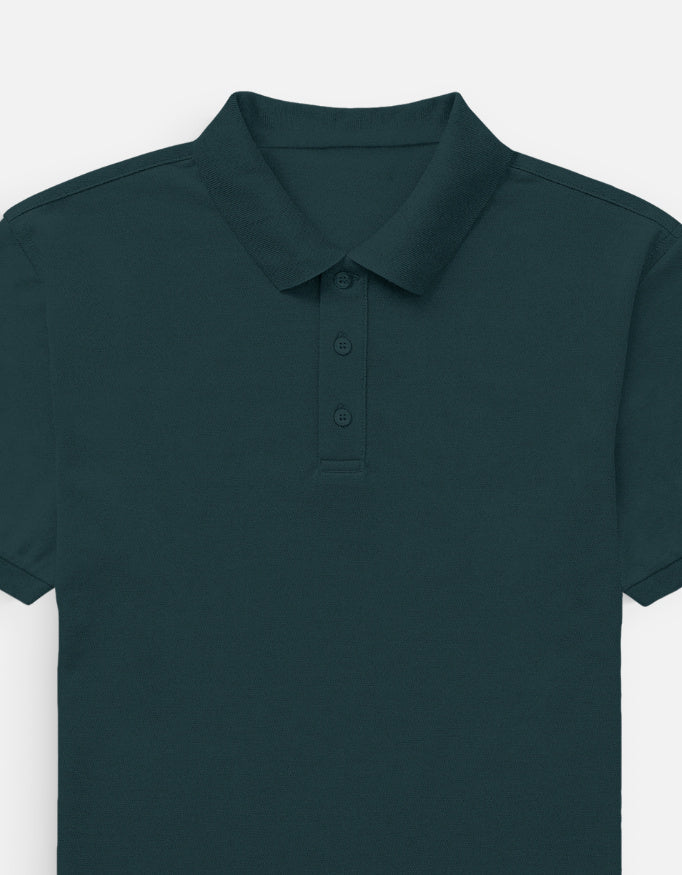 Color_PetrolBlue. Classic short-sleeved polo shirt with a structured ribbed collar and two-button placket. High-quality pique cotton fabric in a solid color, offering a sharp yet relaxed regular fit for a unisex smart-casual aesthetic.
