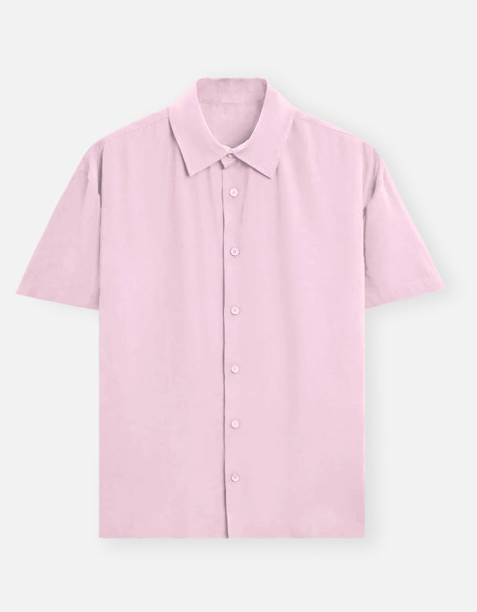 Color_LightBabyPink. Classic long-sleeved button-down shirt in a solid premium cotton fabric. Features a structured collar, adjustable cuffs, and a regular fit designed for a versatile unisex silhouette. Ideal for smart-casual styling and layering.