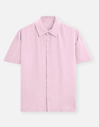 Color_LightBabyPink. Classic long-sleeved button-down shirt in a solid premium cotton fabric. Features a structured collar, adjustable cuffs, and a regular fit designed for a versatile unisex silhouette. Ideal for smart-casual styling and layering.