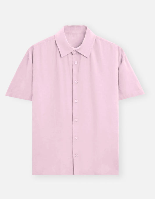 Color_LightBabyPink. Classic long-sleeved button-down shirt in a solid premium cotton fabric. Features a structured collar, adjustable cuffs, and a regular fit designed for a versatile unisex silhouette. Ideal for smart-casual styling and layering.